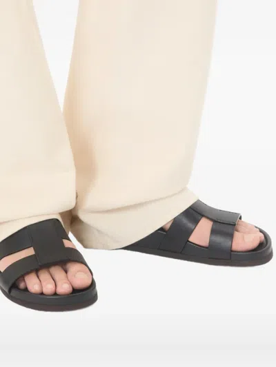 Valentino Garavani Studshield Logo-embellished Leather Sandals In Black