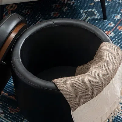 Kirkland's Round Black Faux Leather Storage Ottoman In Black