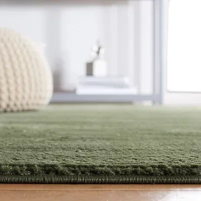 Kirkland's Solid Green Revive Area Rug In Green