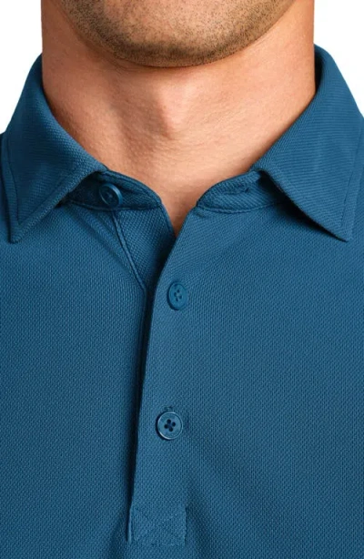 Rhone Regatta Piqué Performance Polo In Blue