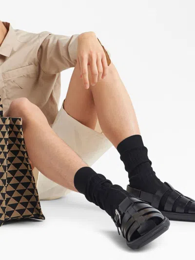 Prada Interwoven Straps Leather Sandals In Black