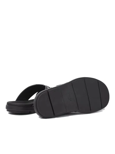 Prada Triangle Logo Criss-cross Sandals In Black