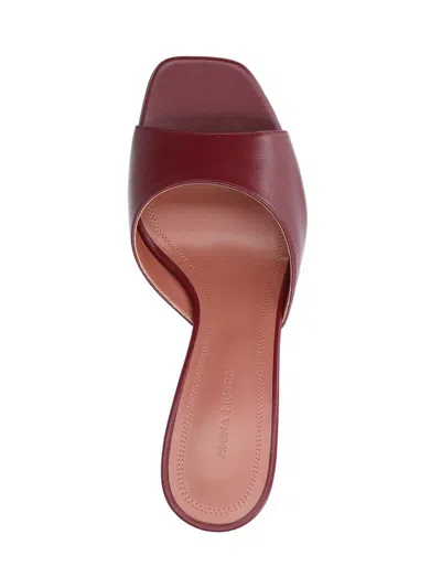 Amina Muaddi Sleek Pumps With Bold Red Heel And Contemporary Design In Brown