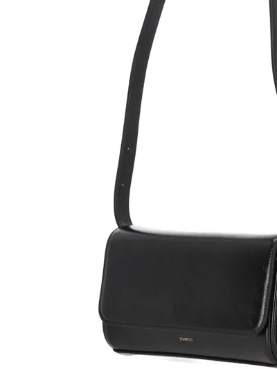 Stand Oil Butter Adjustable-strap Clutch Bag In Black