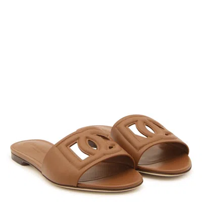 Dolce & Gabbana Slide Sandals With Cut Out Logo In Leather Woman In Brown