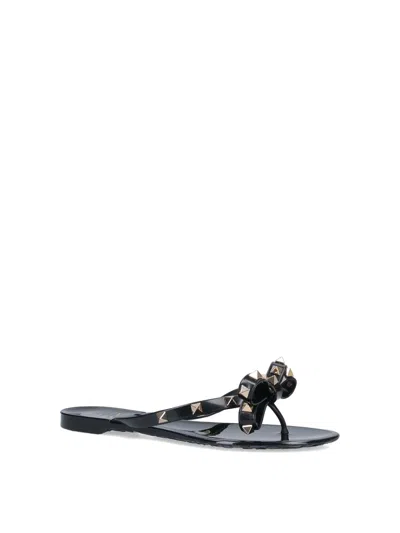 Valentino Garavani Mini Bow Sandals With Platinum-finish Studs In Black