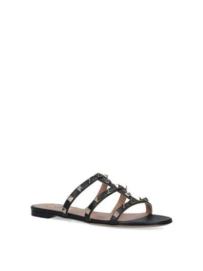 Valentino Rockstud Slide Sandal In Laminated Nappa With Cabochon In Black
