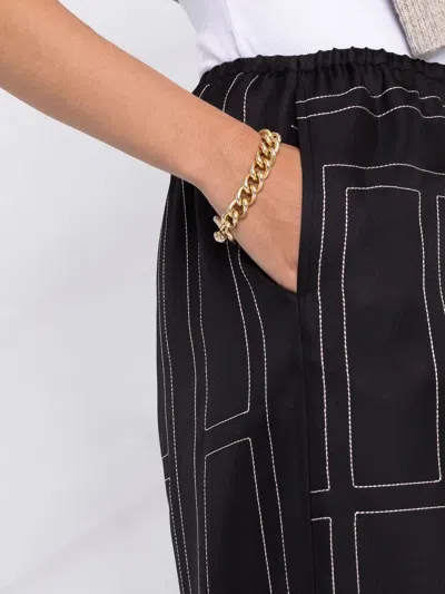 Totême Toteme Women Silk Trousers With Monogram Logo Embroidery In Multi