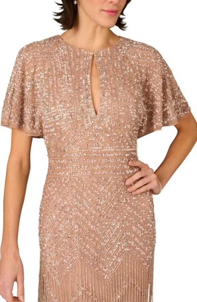 Aidan Mattox Beaded Fringe Flutter Sleeve Maxi Column Gown In Neutral