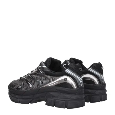 Valentino Garavani Leather Sneakers With Textured Rubber Elements In Black