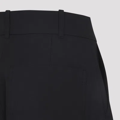 Studio Nicholson Buttoned High-waisted Trousers In Black