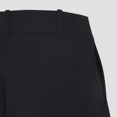 Studio Nicholson Buttoned High-waisted Trousers In Black