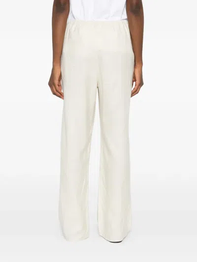 Totême Monogram-pattern Trousers In White