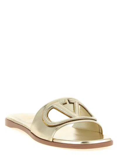 Valentino Garavani Gold Vlogo Cutout Laminated Nappa Leather Sandals In Platinum Antique Brass