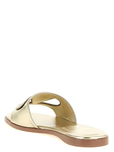 Valentino Garavani Gold Vlogo Cutout Laminated Nappa Leather Sandals In Platinum Antique Brass
