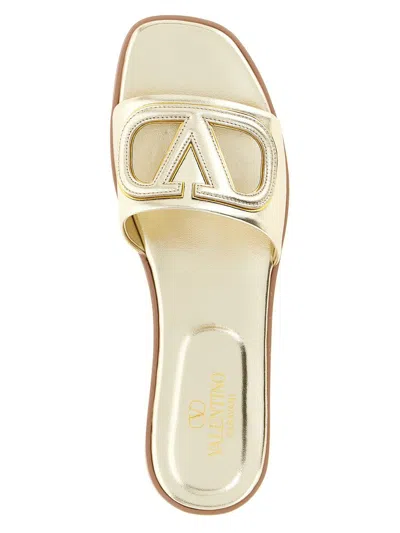 Valentino Garavani Gold Vlogo Cutout Laminated Nappa Leather Sandals In Platinum Antique Brass