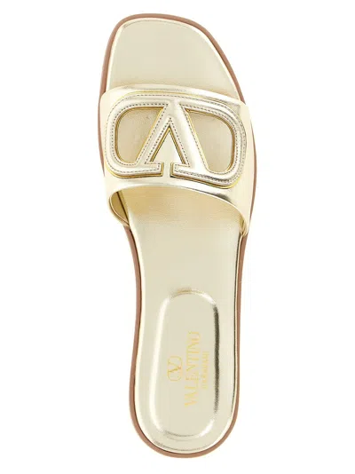 Valentino Garavani Gold Vlogo Cutout Laminated Nappa Leather Sandals In Platinum Antique Brass