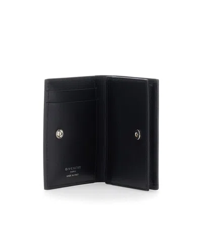 Givenchy Logo Embossed Bi-fold Wallet In Brown