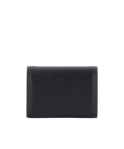 Givenchy Logo Embossed Bi-fold Wallet In Brown