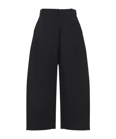 Studio Nicholson Buttoned High-waisted Trousers In Black