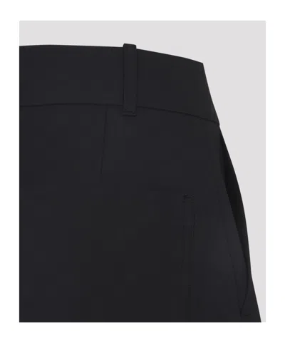 Studio Nicholson Buttoned High-waisted Trousers In Black