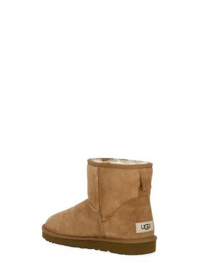 Ugg Classic Mini Brown Ankle Boots With Logo Patch On The Rear And Shearling Lining In Suede Man In Brown