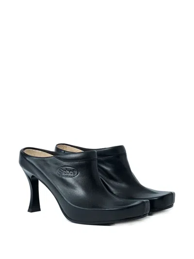 Balenciaga Debossed Logo Heeled Mules In Black