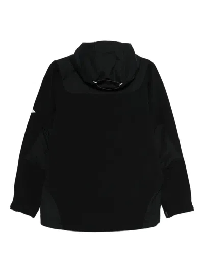 And Wander Stretch Shell Jacket In Black