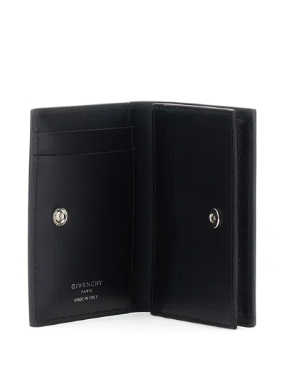 Givenchy Logo Embossed Bi-fold Wallet In Black