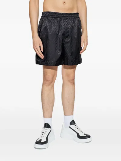 Alexander Mcqueen Skull-patterned Shorts In Black