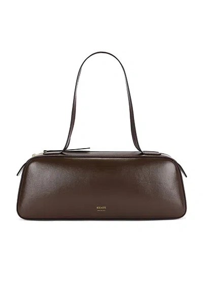 Khaite Simona Crackle Patent Elongated Tote Bag In Brown