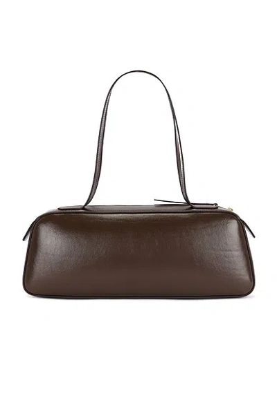 Khaite Simona Crackle Patent Elongated Tote Bag In Brown