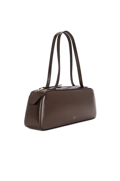 Khaite Simona Crackle Patent Elongated Tote Bag In Brown