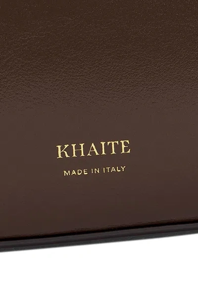Khaite Simona Crackle Patent Elongated Tote Bag In Brown