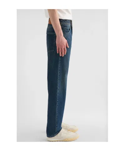 Jil Sander Multi-stitched Embossed Logo Trousers In Blue