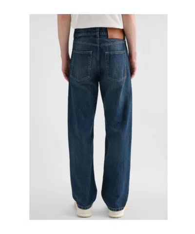 Jil Sander Multi-stitched Embossed Logo Trousers In Blue