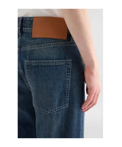 Jil Sander Multi-stitched Embossed Logo Trousers In Blue