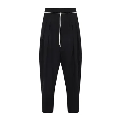 Mordecai Tapered Black Trousers With Pleated Front In Black