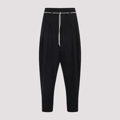 Mordecai Tapered Black Trousers With Pleated Front In Black