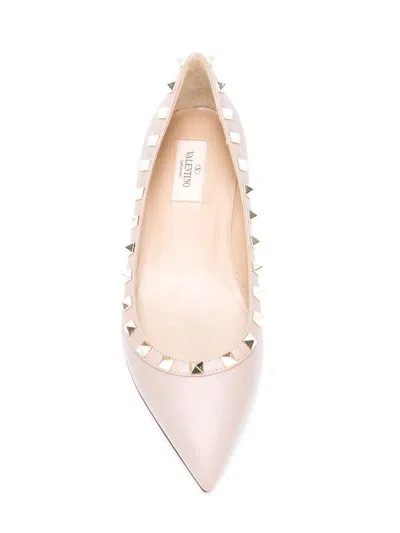 Valentino Garavani Valentino Pointed Toe Flat Shoes With Gold-tone Rockstuds In Pink