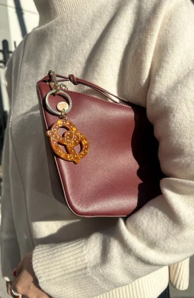 Solar Eclipse Hand-painted Pretzel Bag Charm & Keychain In Brown