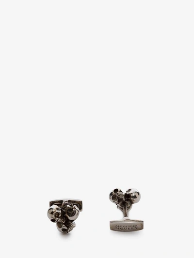 Shop Alexander Mcqueen Three Skull Cufflinks In Silver
