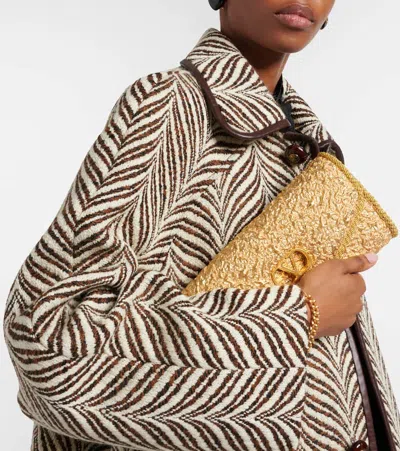 Valentino Garavani Mini Structured Handbag With Signature Detailing In Gold