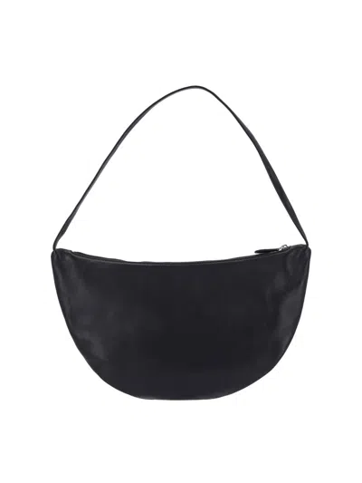 The Row Izzy Small Crescent Shoulder Bag In Leather In Black
