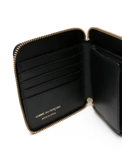 Comme Des Garçons Embossed Logotype Wallet In Black