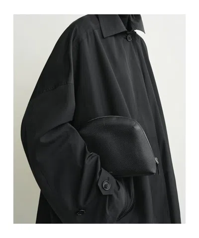 Totême Medium Grained Leather Clutch In Black