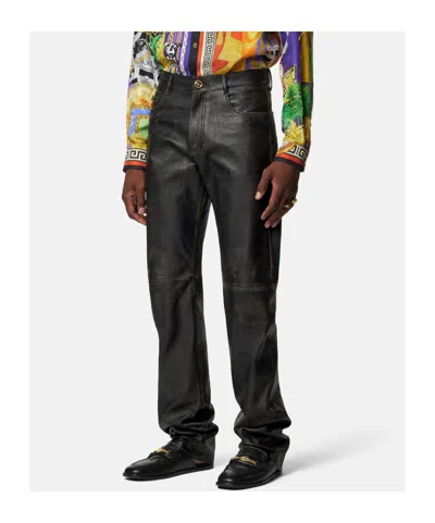 Versace Button-fastening Trousers In Black