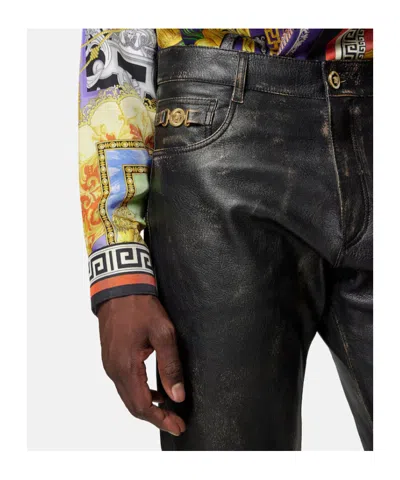 Versace Button-fastening Trousers In Black