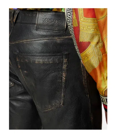 Versace Button-fastening Trousers In Black