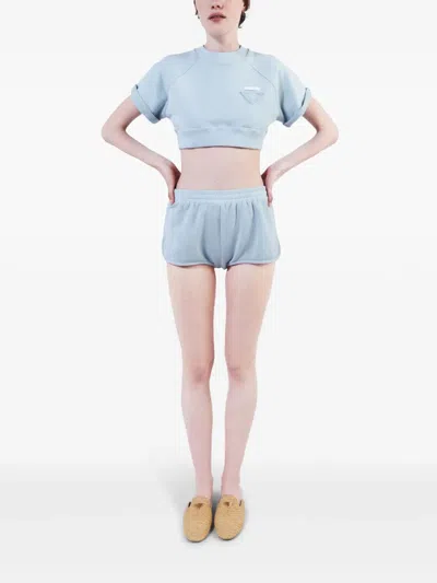 Prada Triangle-patch Jersey Mini Shorts In Blue
